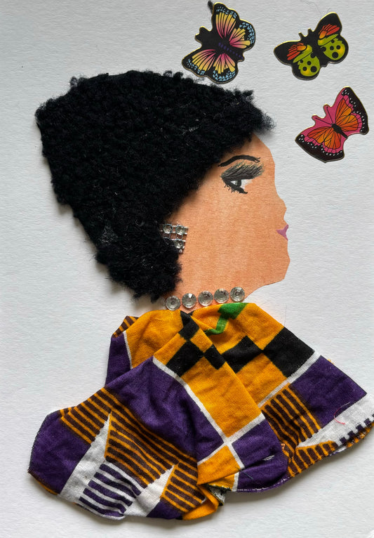 I handmade this card of a woman named Battersea Butterfly. She’s shown in profile with a voluminous textured black hairstyle, bold lashes, and lilac lipstick. Her earrings and neckline sparkle with silver rhinestones. She wears a vibrant garment made from yellow, purple, black, and white patterned fabric. Three colourful butterfly stickers flutter around her, adding a touch of whimsy to her regal presence.