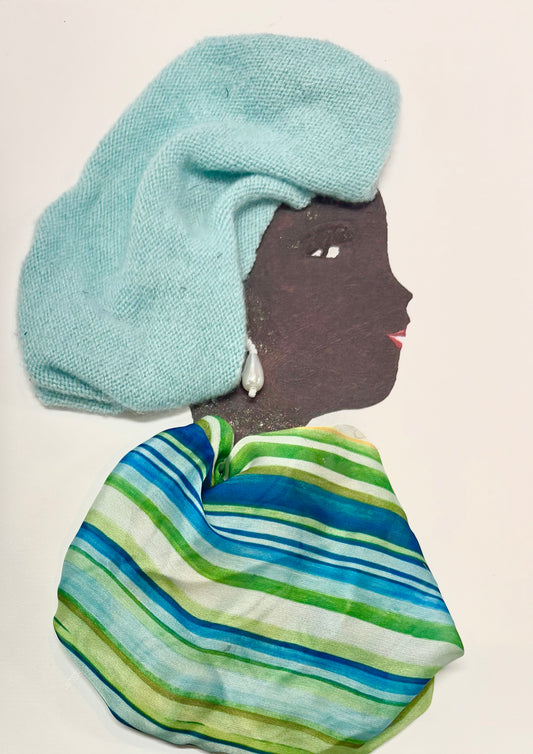 A woman wears a cloth-like headwrap that is light blue. Her blouse is made up of stripes consisting of greens and blues. She wears a pearl drop earring.