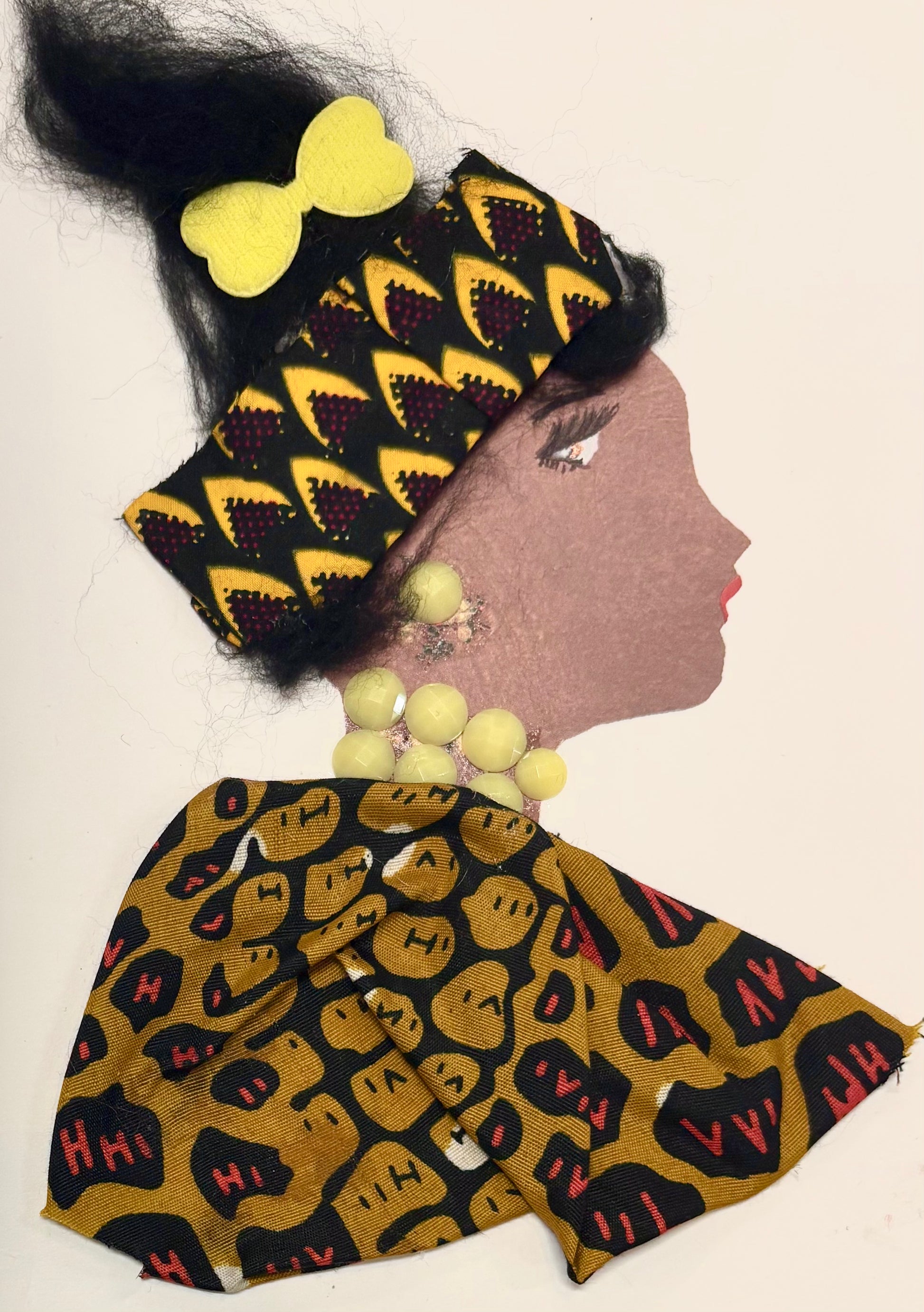 This woman has her hair in an updo. She wears a yellow bow in her hair and a headband with an ankara pattern feauring yellow, red, and black. Her blouse has another ankara pattern with a similar colour pallete, with yellow, black and red. She wears pastel yellow jewellery that is rounded.
