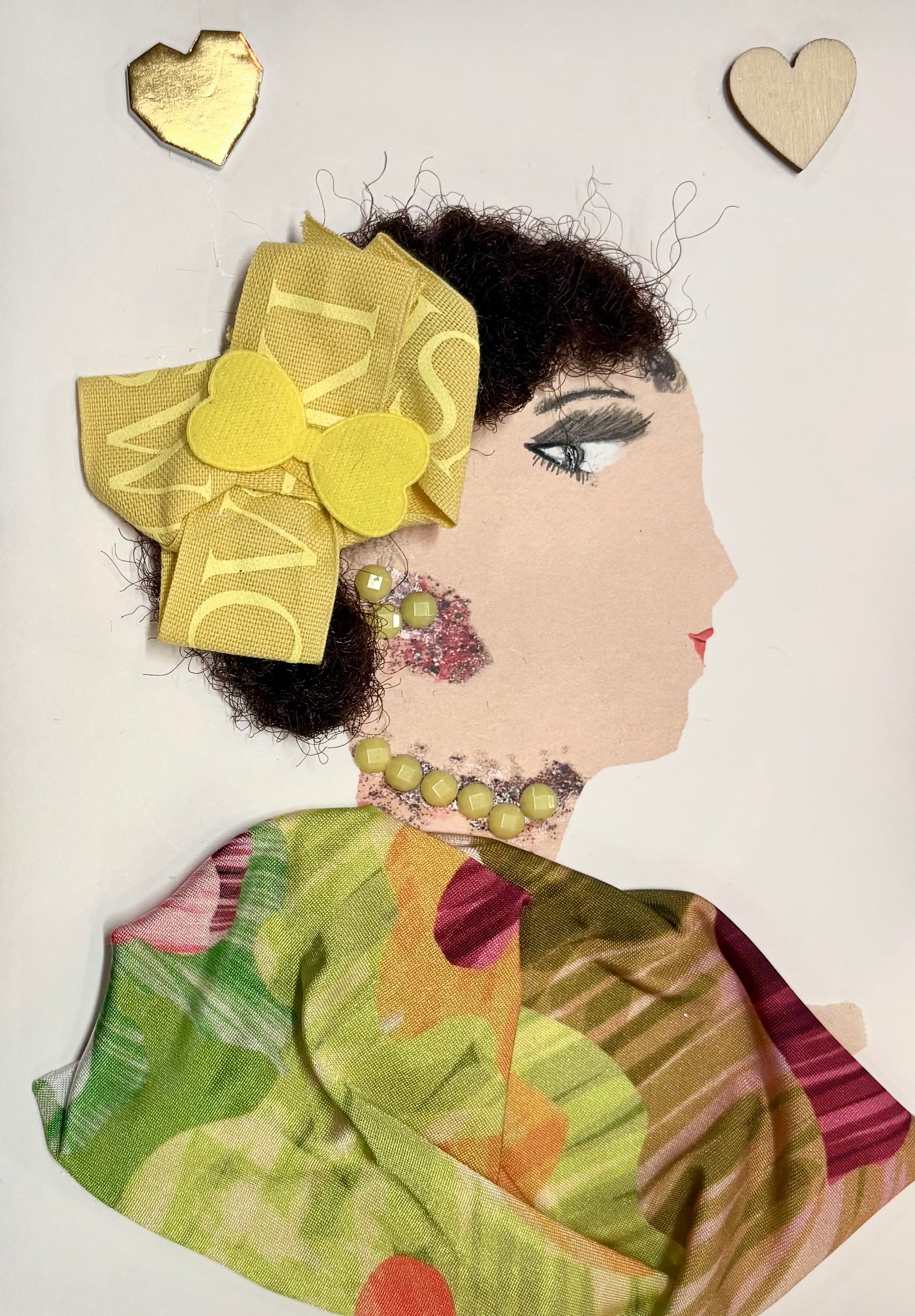 Chelsea Sunshine radiates joy and warmth. Her vibrant yellow bow and cheerful beaded jewelry perfectly complement her multicolored, floral-patterned outfit. The two heart motifs floating nearby highlight her sweet and loving aura.