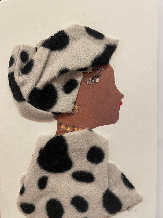 This is a handmade card of a woman named Dollis Hill Delilah, featuring a fuzzy white and black spotted head wrap and matching top, and red lipstick.