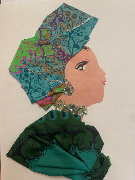 A handmade card showing a woman in profile wearing a richly patterned turquoise and green outfit and matching headwrap. She wears a gem necklace and earring in pale green and silver.