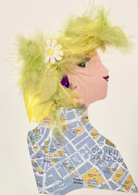 This one of a kind card was delightfully handmade. The woman featured has yellow feathered hair and a daisy as an accessory. She wears a map inspired blouse and a purple earring