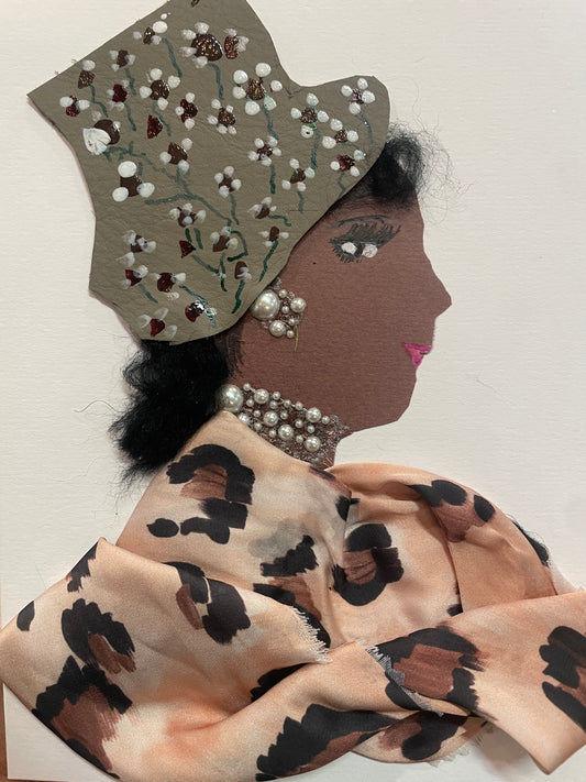 This is a handmade card of a woman named Nyah Notting Rise. She wears a grey hat with painted flowers, a brown animal-print blouse, and pearl-like jewellery. The background is plain.