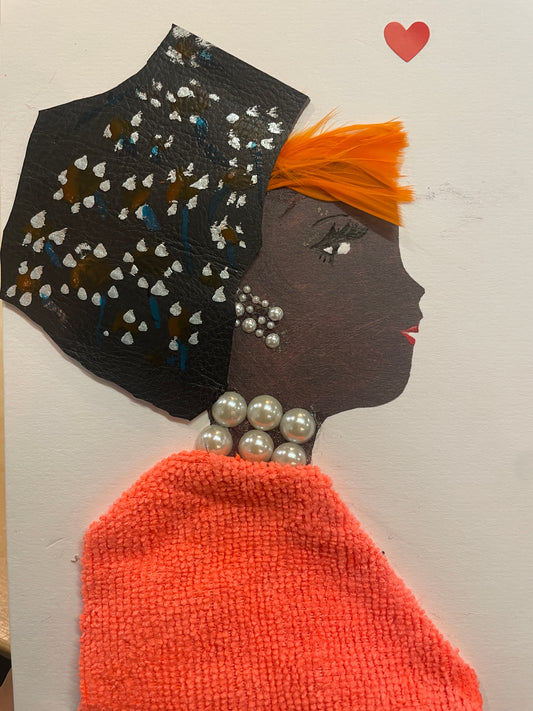 This is a handmade card of a woman named Solene Seaford. She wears an orange blouse, has orange hair, a black hat with painted flowers, and a red heart sticker in the corner.