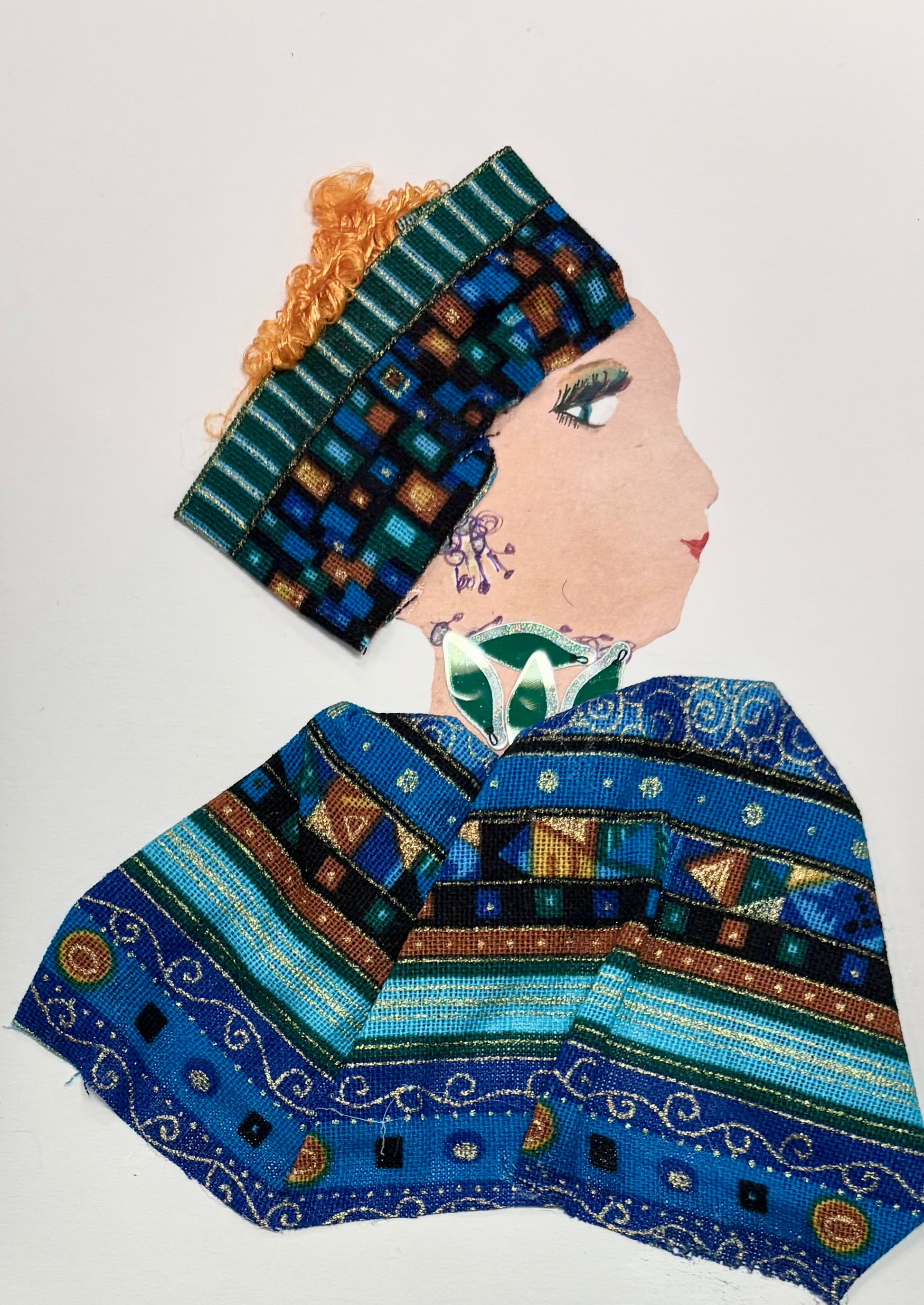 A woman wears a multicoloured headband with her orange hair peaking out the top. Her blouse is matching, featuring different oranges, blues, browns, and teals. She wears a green necklace.