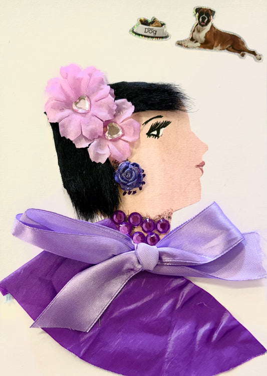 Handmade portrait of a woman in profile. She has black hair decorated with pink fabric flowers and a purple rose earring. She wears a purple outfit with a large satin bow and a necklace made of purple gems. Two dog-themed stickers are placed above her head, one of a dog bowl and one of a brown and white dog.