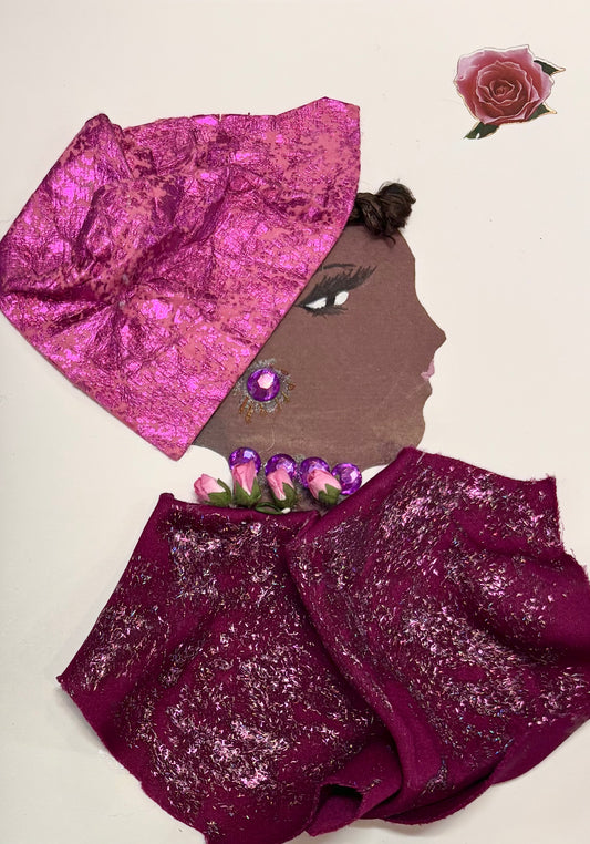 This is a handmade card of a woman named Magenta Mabel. She wears a shimmering pink headwrap and has her hair styled neatly underneath. Her earring and necklace are made of large purple gems, with tiny pink rosebuds added as a delicate detail. Her outfit is crafted from deep magenta fabric decorated with sparkling silver flecks. Her face is drawn in profile with soft features and pale pink lips. A rose sticker floats in the top corner.
