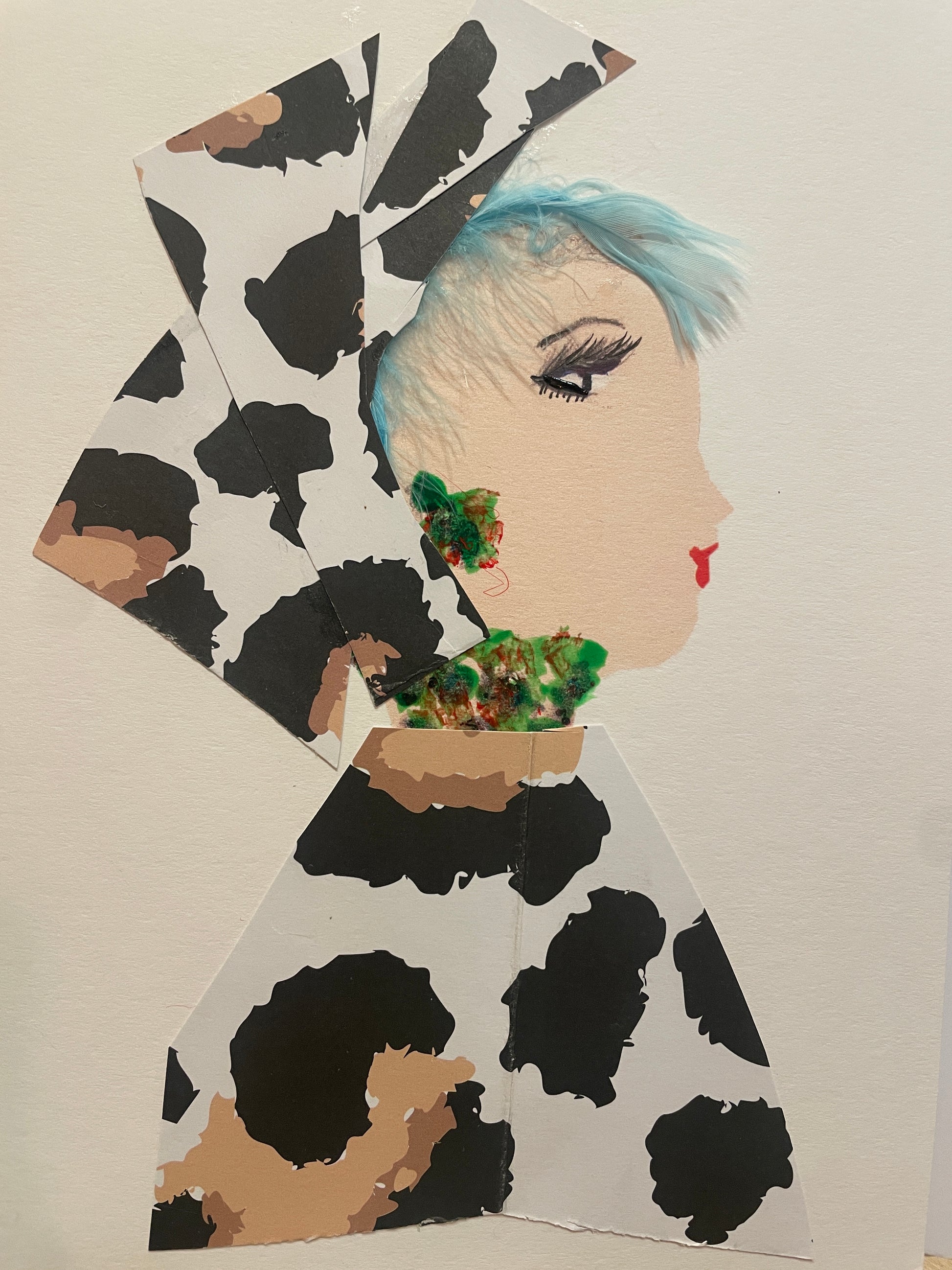 This is a handmade card of a woman named Magnificent Madison, featuring light blue hair, a tall white, brown, and black head wrap, a matching outfit with black and beige abstract spots, and green-and-red textured earrings and necklace.