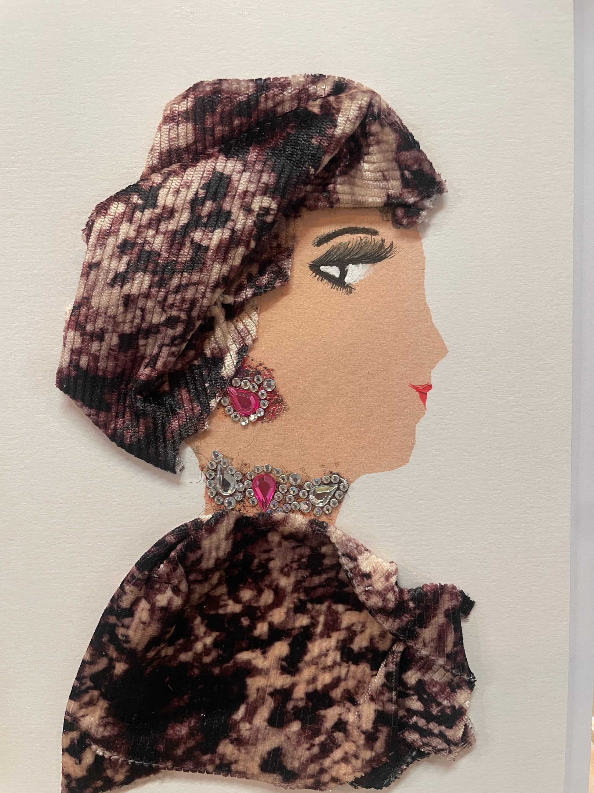 This is a handmade card of a woman named Noore wearing a deep pink and black velvet-style outfit and headwrap. She has a large jewel necklace and matching earrings.