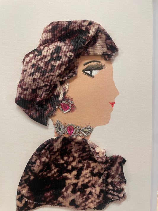 This is a handmade card of a woman named Noore wearing a deep pink and black velvet-style outfit and headwrap. She has a large jewel necklace and matching earrings.