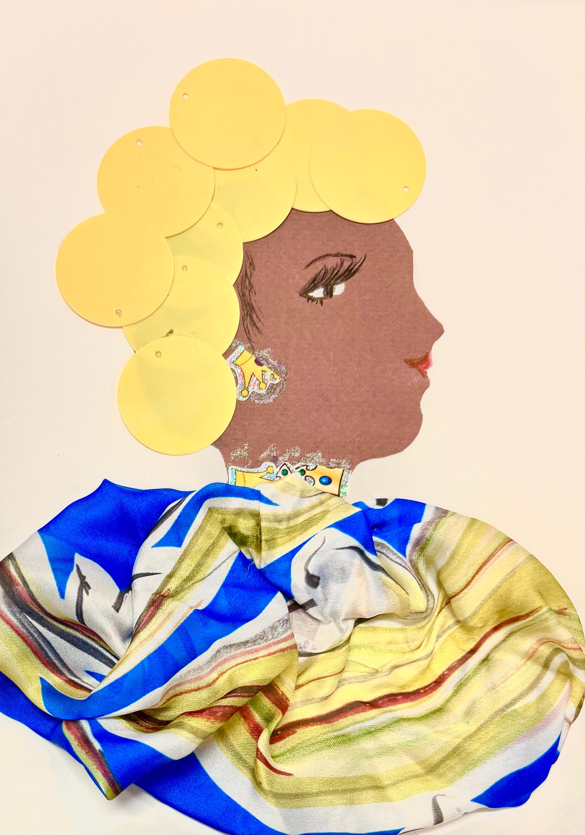 I handmade this card of a woman named Primrose Polly. Her hair is created with bright yellow circular pieces arranged in a voluminous style. She wears a colorful, silky outfit made of fabric in blue, yellow, white, and red stripes. Her look is completed with a sparkly earring and necklace, both decorated with small jewel-like accents.