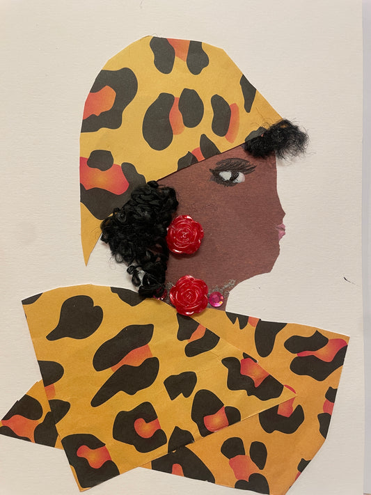 A handmade card of a woman named Rea Richmond in profile wearing a golden-yellow animal print wrap and red flower-shaped earrings. Her outfit matches her headwrap.
