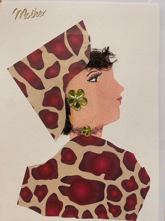 This is a handmade card of a woman named Royal Ruby Regent, wearing a red and tan patterned outfit and head wrap, green gem jewellery, and a textured brown hairstyle. The word "Mother" is displayed in gold in cursive in the top left corner