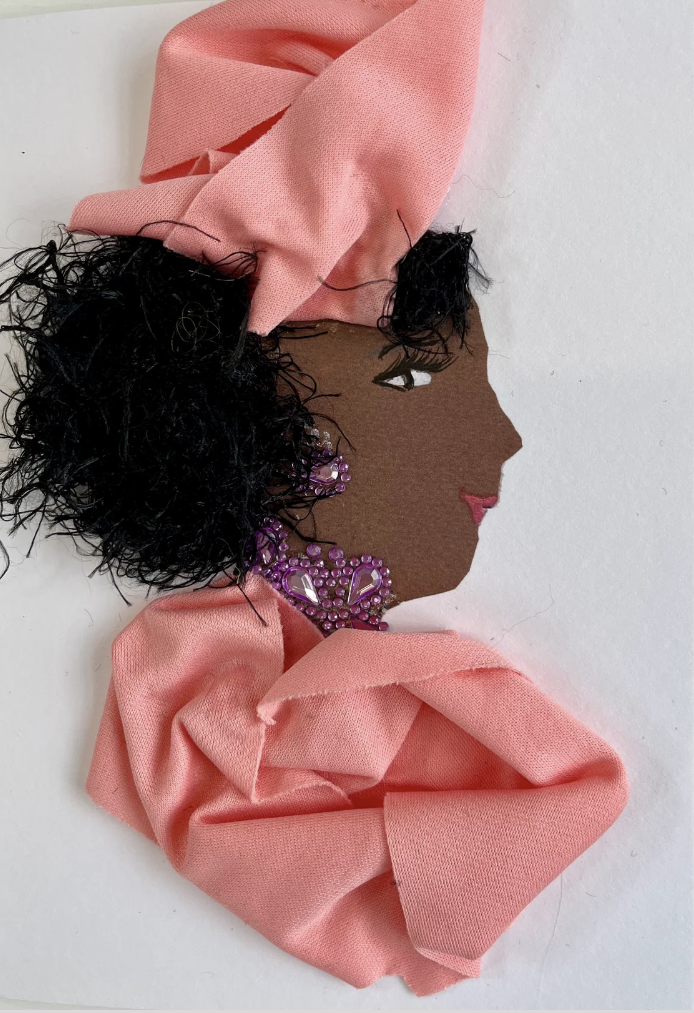 Petunia Paddington is wearing a bubblegum pink outfit with an accent of purple jewellery.