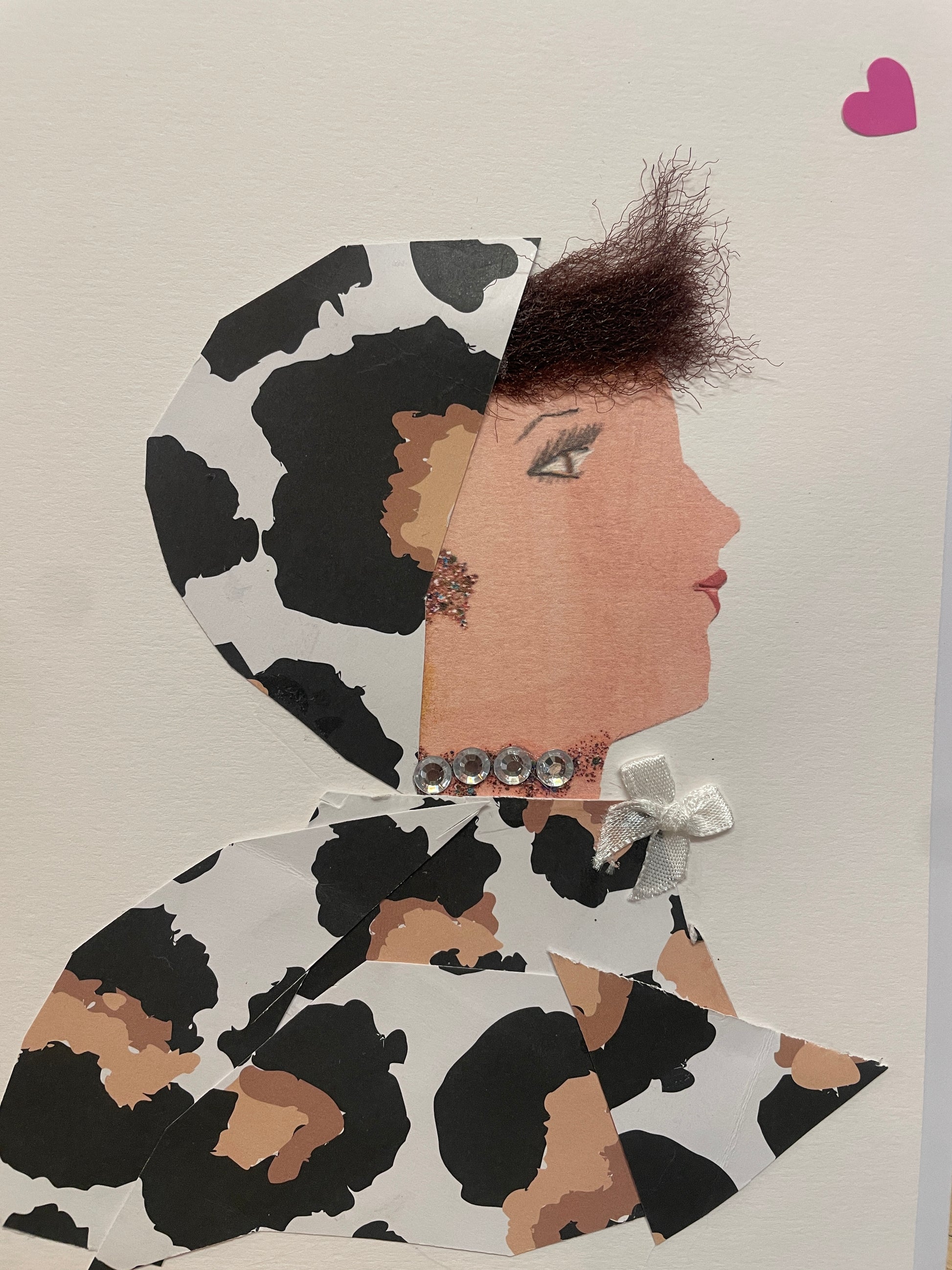 This is a handmade card of a woman named Sweetheart Samara, featuring a white and black spotted head wrap and outfit, a fluffy short hairstyle, a silver crystal necklace and a small white ribbon bow. A small pink heart can be found in the top right corner.