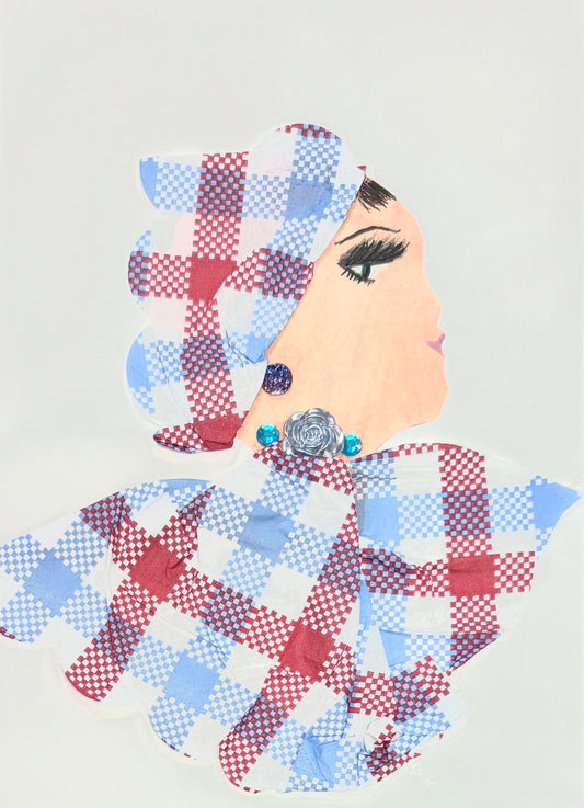 A handmade greeting card featuring a woman in profile, dressed in red, white and blue checkered fabric with a matching headwrap. The design is accented with shiny embellishments and a silver rose decoration.