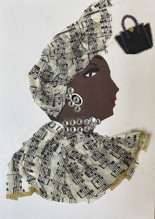 I designed this handmade card a woman dressed in a music sheet patterned blouse and hatinator. The matching set is paired with her silver gemstone jewellery and a black handbag.