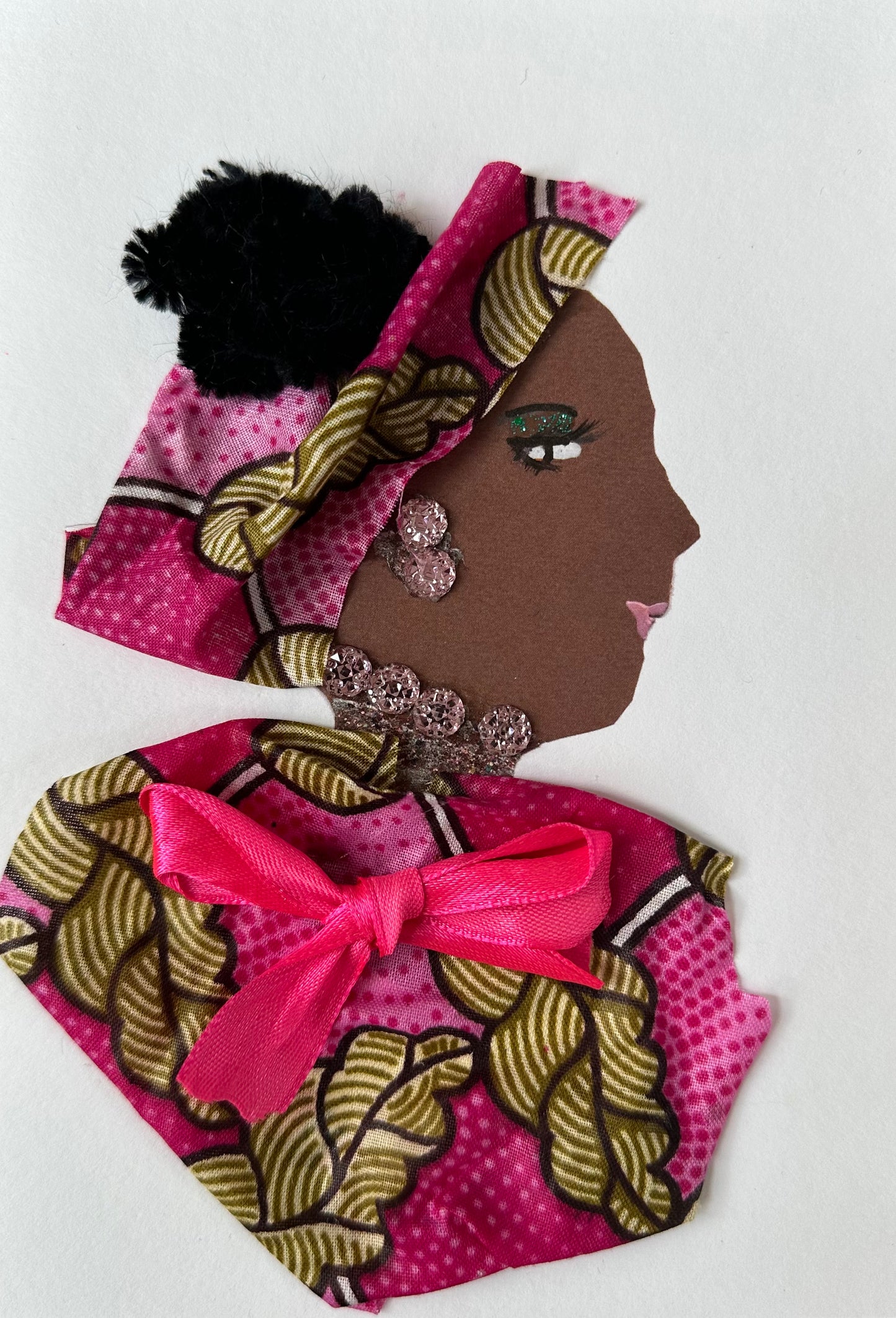 I designed this handmade card of a woman wearing a pink patterned blouse and hatinator with walnut coloured accents. She has a bright pink bow in the center of her blouse. Her earrings and necklace match with the soft pink colour.