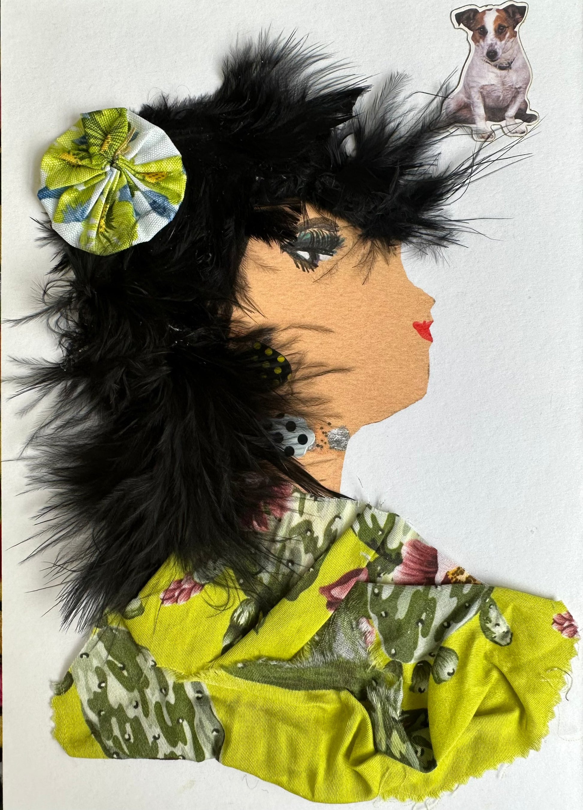 I created this handmade card of a woman with jet black hair wearing a bright, lime green blouse. The blouse has cactuses and small pink flowers. She has hair clip that matches the material of the blouse. Additionally, there is a dog in the upper left corner of the card.
