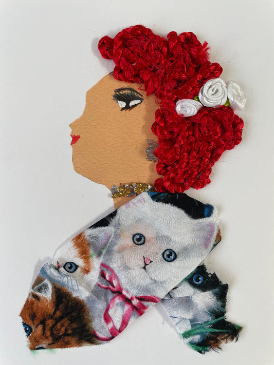 I designed this card of a woman who is named Whitney Westminster. She has a white skin tone with curly red hair. In her hair there are three white flowers. She wears a cat print blouse. She wears silver and gold jewellery.