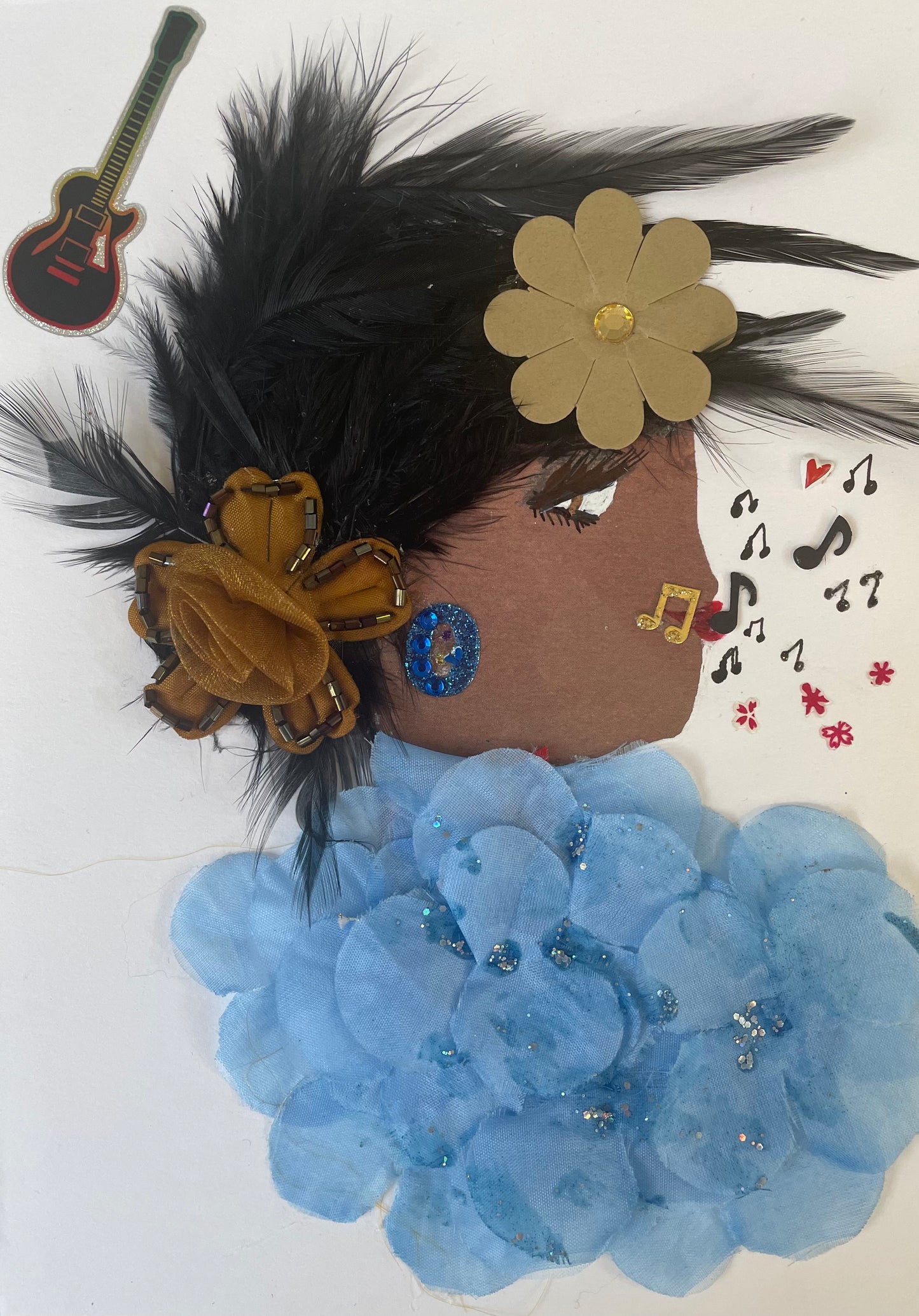 This is a woman named Musical Blue. She has light brown skin with black feathery hair. She wears a green and brown flower in her hair. She is wearing a blue floral texture blouse with silver sparkles. She wears blue sparkly circle earrings. She has a variety of music notes coming out of her mouth. In the top corner there is a black guitar.