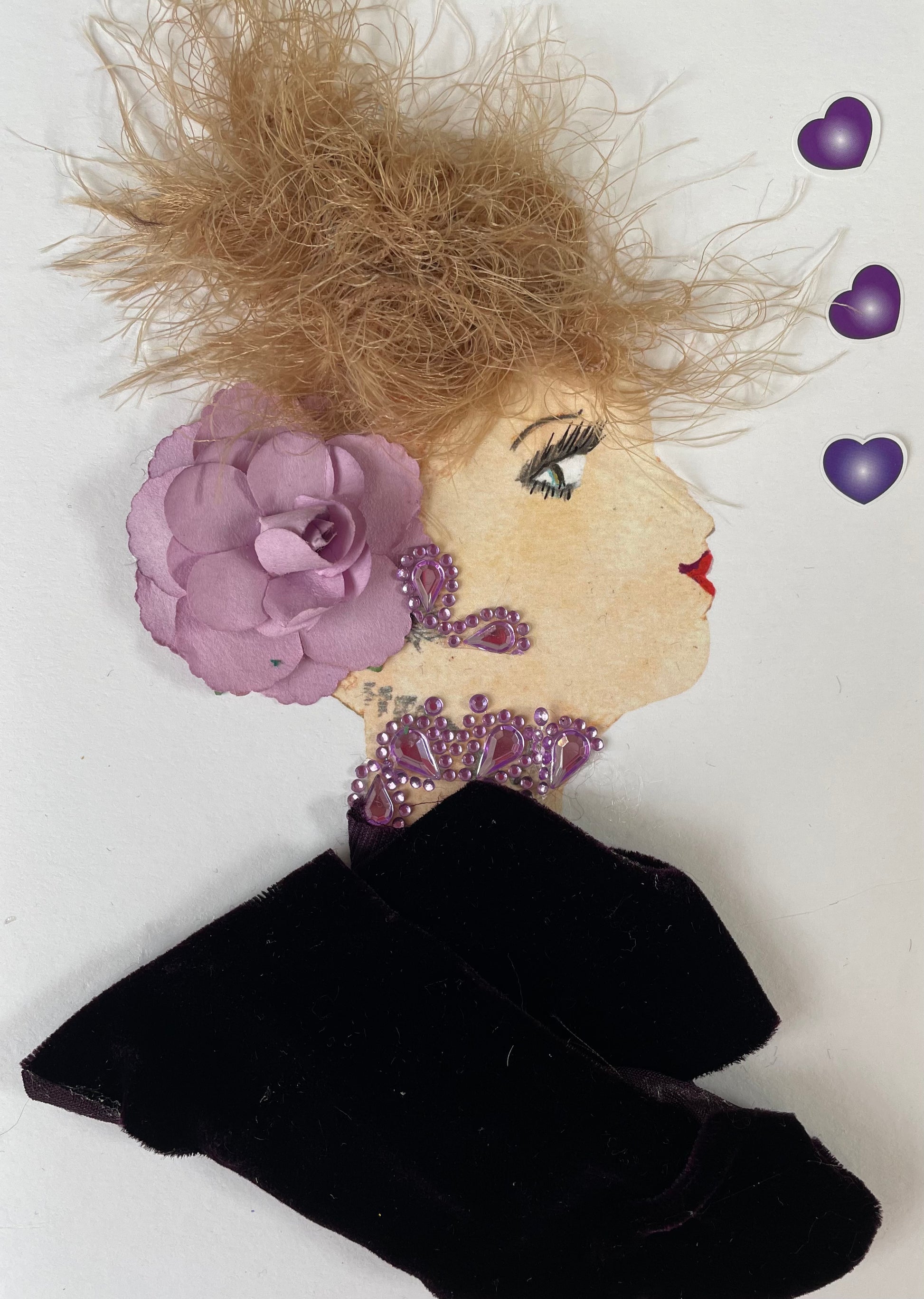 I designed this card of a woman named Doctor Regal Purple. She has a white skin tone and is wearing a dark purple blouse with light purple diamanté earrings and necklace. She added a light purple flower to her hair. There are three dark purple  hearts to the right of her.