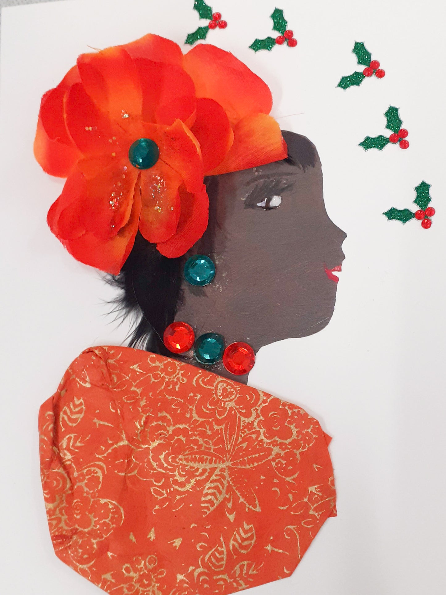 This card is called Orange Party. She wears a orange blouse with gold floral detail, and a large orange flower in her hair. Surrounding her, there is mistletoe.