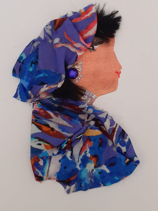 This card shows a woman named Alexandria wearing a blue and purple floral print matching outfit. Her subtle jewellery is silver and purple.