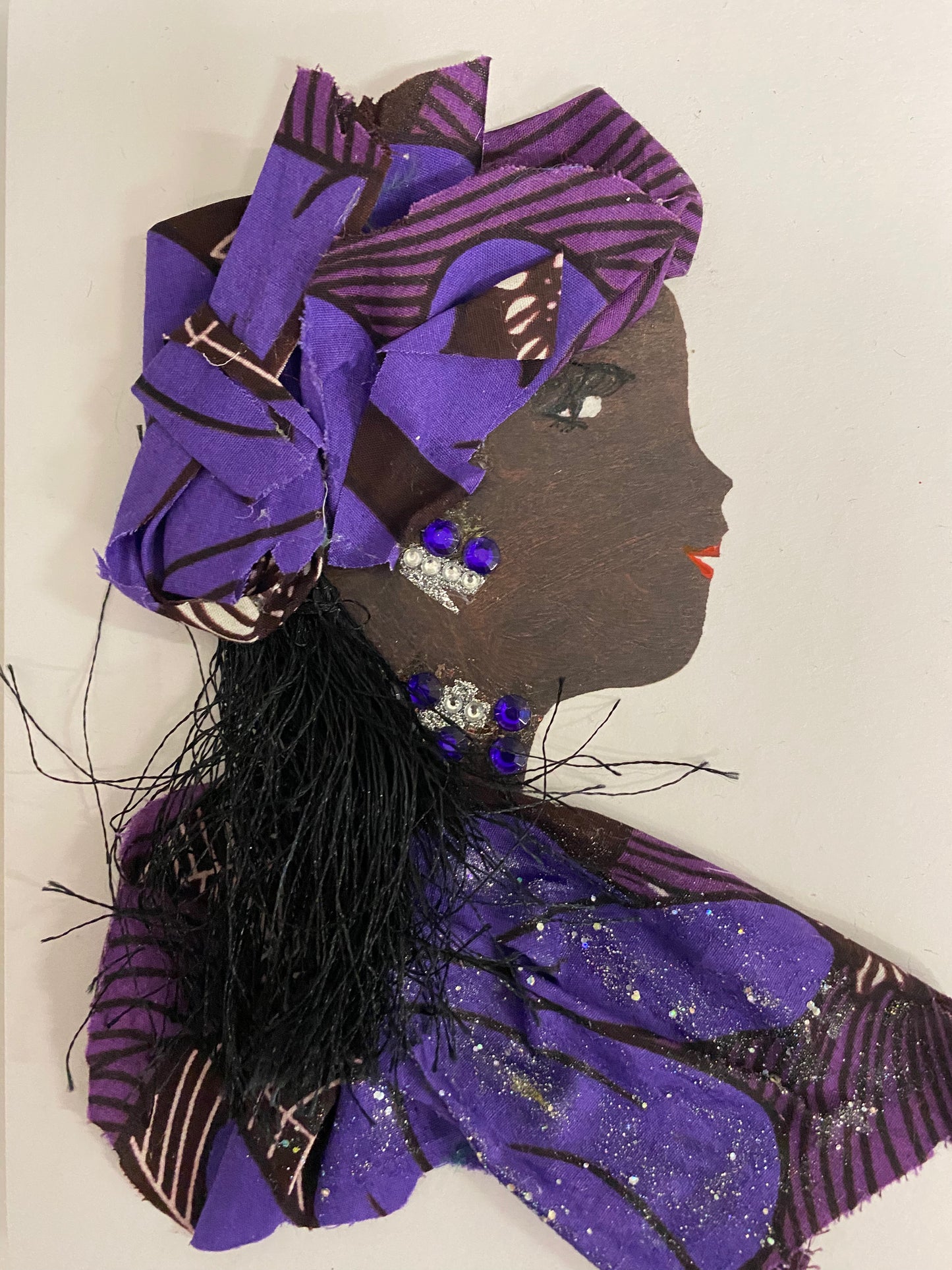 I designed this card of a woman who is wearing pattern hat filled with multiple shades of purple. She is wearing a pattern blouse that also has multiple shades of purple. She wears darling silver jewellery.