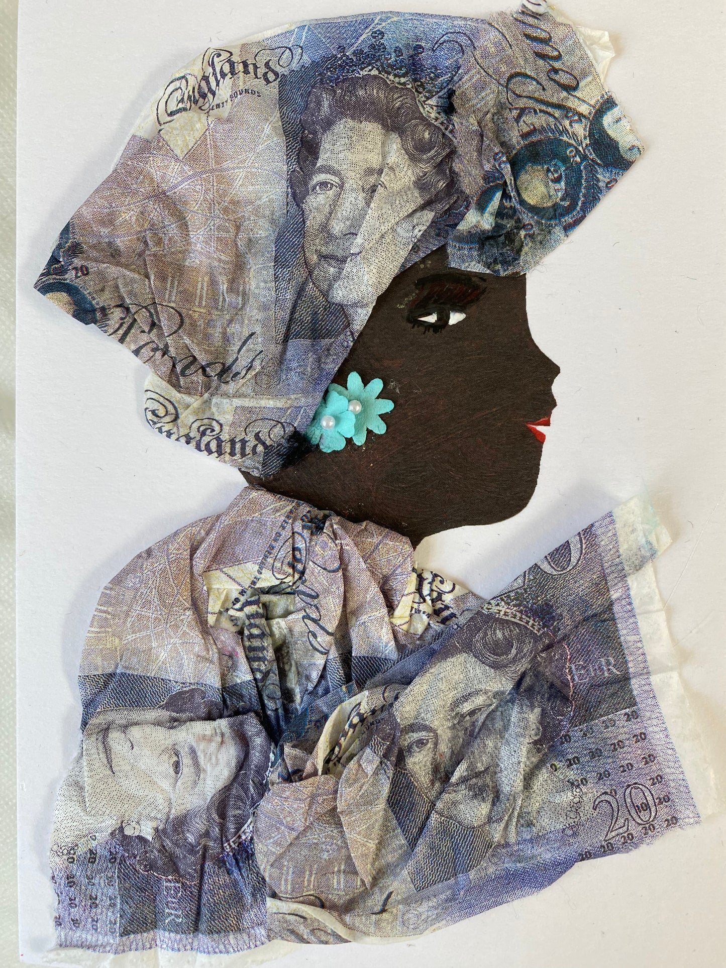I designed this card of a woman who is wearing a charming purple money print headwrap. She wears a gorgeous purple money print blouse. She wears beautiful light blue flower earrings.