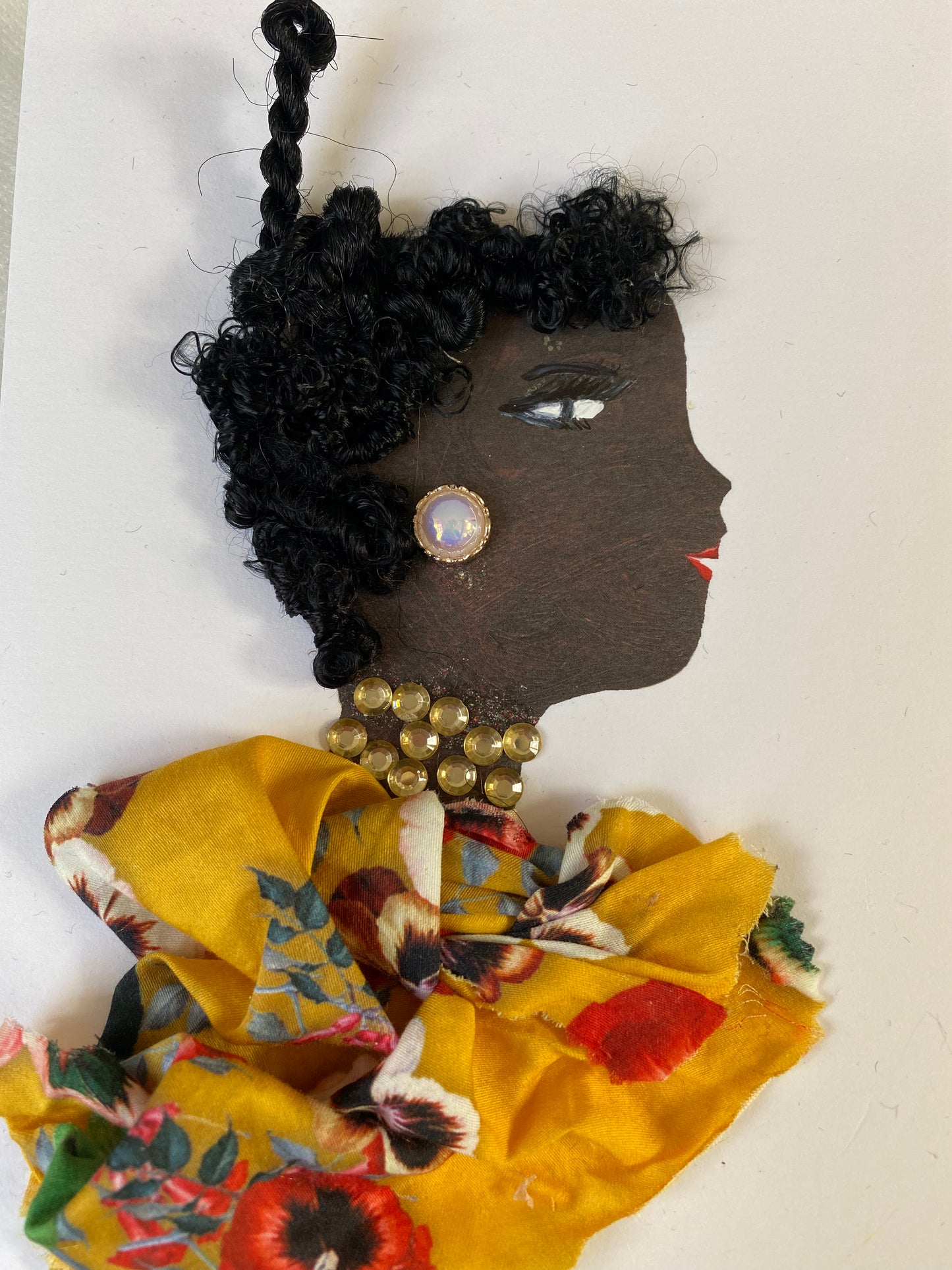 I designed this card of a woman named  who is wearing a beautiful yellow floral blouse. She wears pearl earrings and a gorgeous gold necklace.
