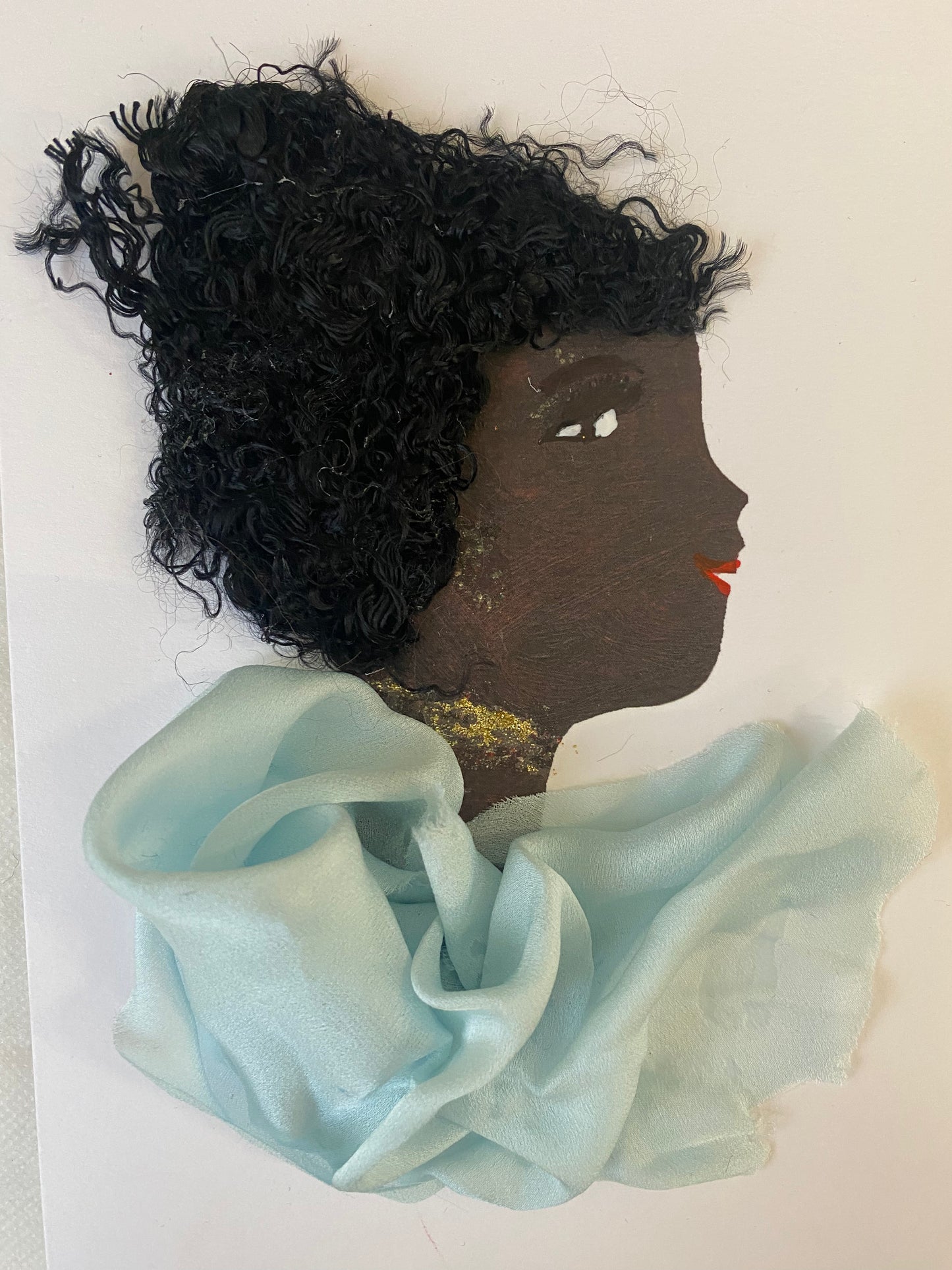 i designed this handmade card of a women who has a stylish hairstyle and is wearing a baby blue silk blouse. She also wears sparkly gold jewellery. The card is vibrant and colourful, making this card perfect for any special occasion.