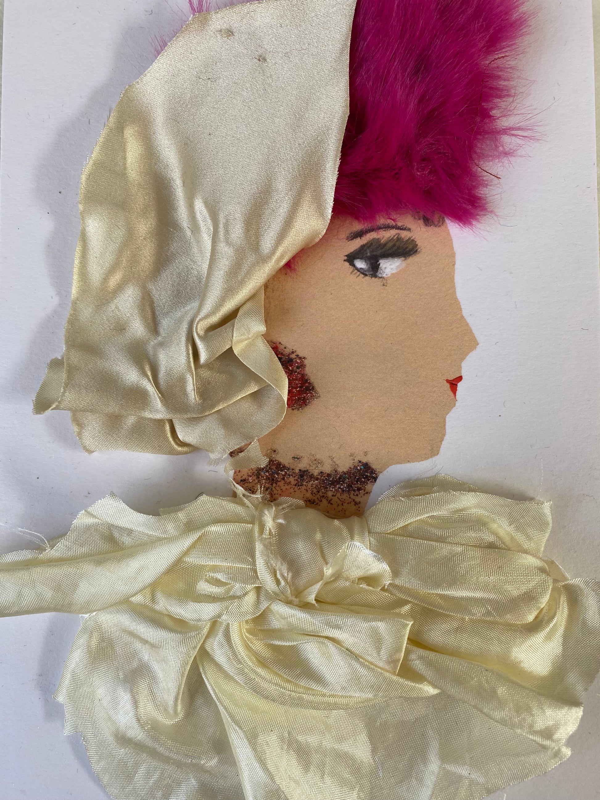 I designed this card of a woman named Portebello Princess. She has a white skin tone and is wearing a silky yellow head wrap. She wears a textured silky yellow blouse. She wears pretty red jewellery.