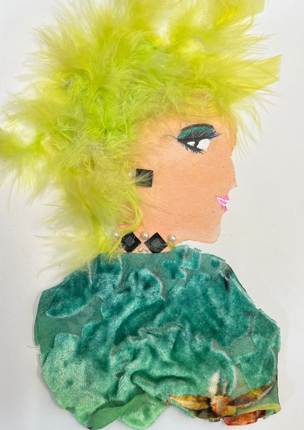 This card is of a woman given the name Sunflower Daisy. Sunflower wears a green velvet material top with a necklace made up of black diamonds and pearls. Her hair is electric yellow and feathery.