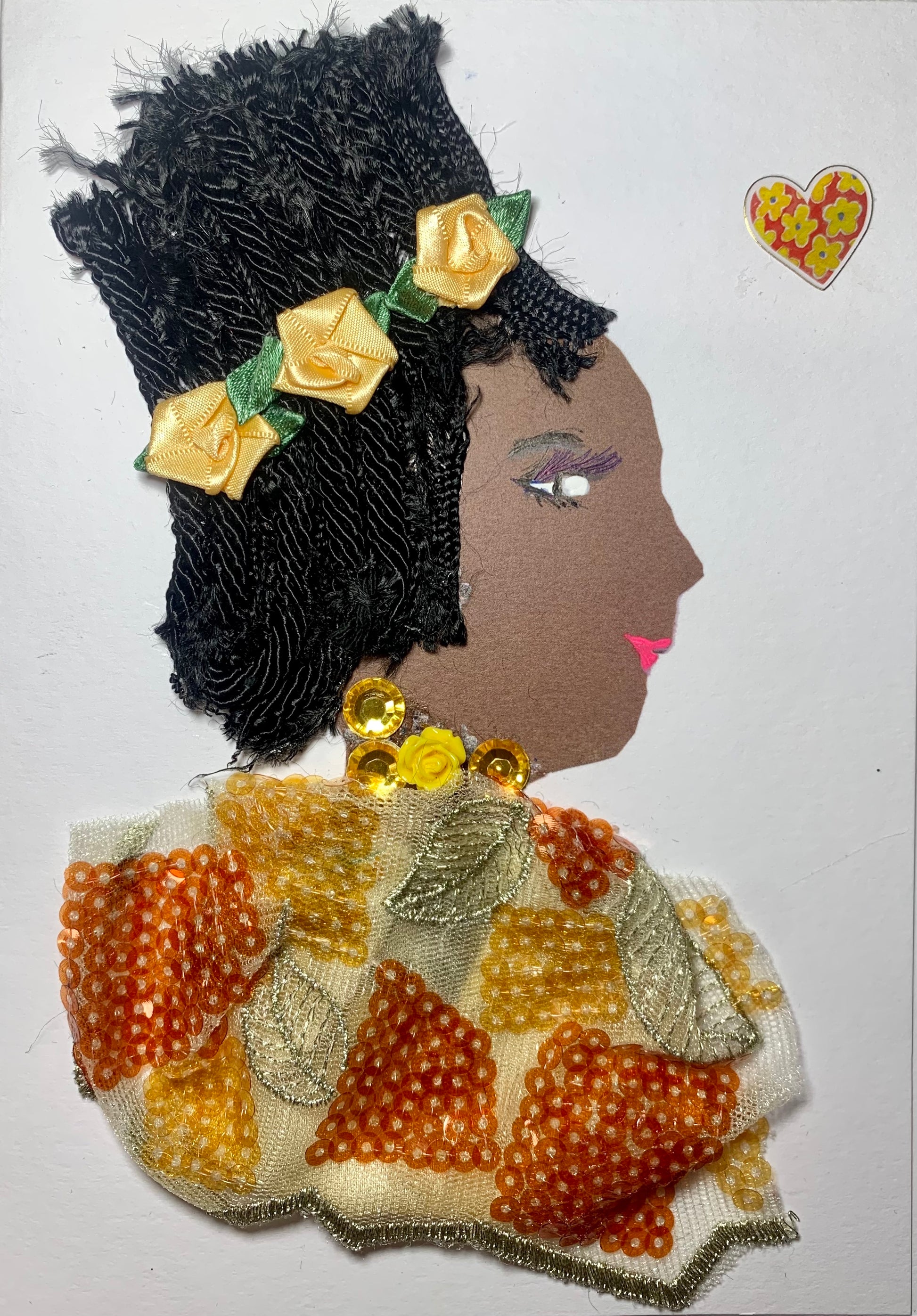 This card is called Ibadan pie, and she is wearing an orange sequined blouse with matching orange roses in her black braided hair.
