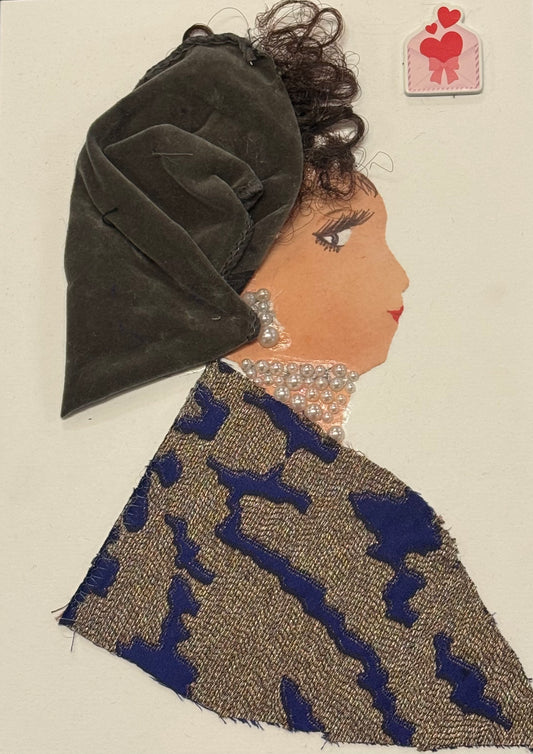 A side-profile collage of a woman with a warm medium skin tone against a plain white background. She wears a large, draped velvet headwrap in a deep grey color, with visible folds and a soft, matte texture. Dark curly hair emerges slightly from beneath the wrap. Her outfit consists of a textured fabric in beige tones with bold, abstract blue patterns. Around her neck and ear are layered pearl embellishments forming jewelry. Her facial features are drawn with a defined eye, lashes, and a subtle lip. 