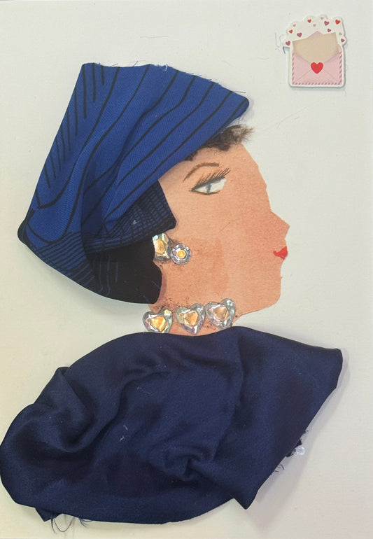 Handmade greeting card that can double as a piece of art featuring a side-profile collage of a woman wearing a matching navy blue headpiece and shawl, with crystal earrings and a necklace, styled in a clean and minimal look. Also featured is a love letter popping out of an envelope, that is surrounded by tiny red and pink hearts and also has a big red heart seal.