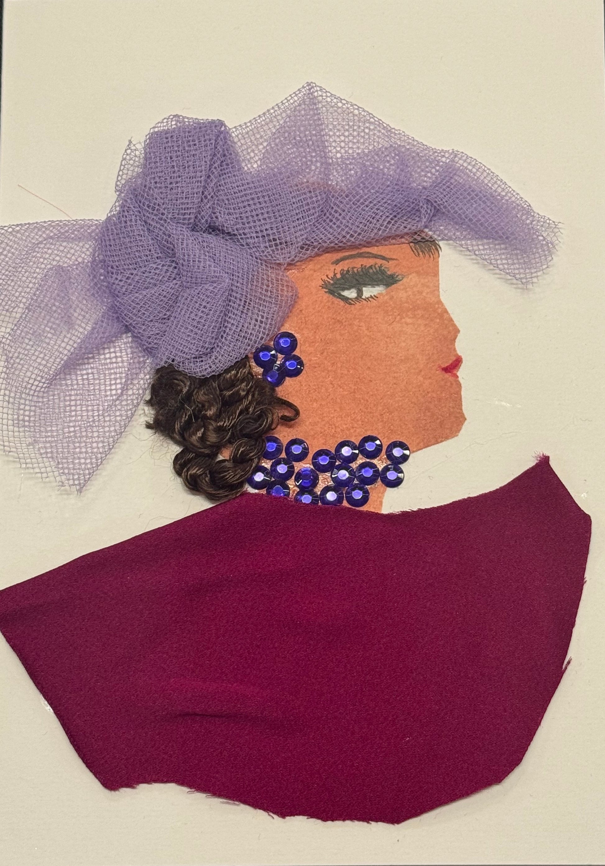 A side-profile collage portrait of a woman facing right, with warm-toned skin and dark brown curled hair gathered beneath a structured purple mesh headpiece that forms a bow-like shape. She wears bold blue gem earrings and a matching clustered necklace. Her clothing is a deep purple fabric draped across her shoulders. Her eye is defined with long lashes and dark liner, and her lips are red. The textures include mesh fabric, smooth reflective gems, and soft cloth, creating a balanced and elegant composition.