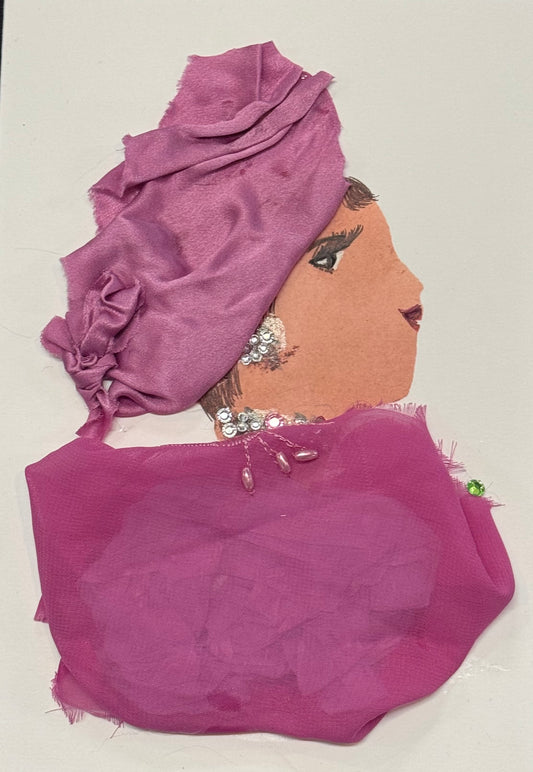Handmade greeting card that can double as a piece of art featuring a profile collage of a woman wearing a wrapped pink headscarf and layered pink fabric clothing. She has rhinestone earrings and subtle decorative details on her neckline. There also is a small green detailed gem at the front of the blouse, adding a striking feature. The tones are entirely pink with a soft, flowing texture.