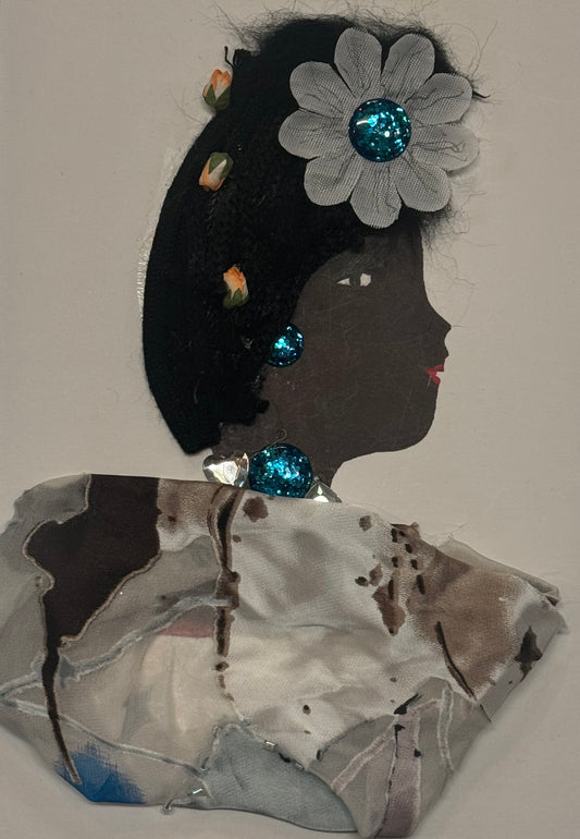 Handmade greeting card that can double as a piece of art, featuring a woman with dark hair decorated with a large white daisy flower with a sparkling blue jewel in the center of flower. She also has small detailed peach colored tullips placed in her hair like charms. She wears a soft patterned grey, white, brown, and blue shawl made from layered fabric textures.