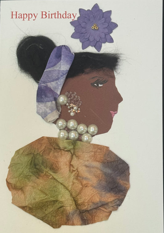 Handmade greeting card that can double as a piece of art featuring a side-profile collage of a woman with dark skin, wearing a purple headband and large pearl jewelry, dressed in earthy-toned fabric, with “Happy Birthday” text and a purple flower above her.