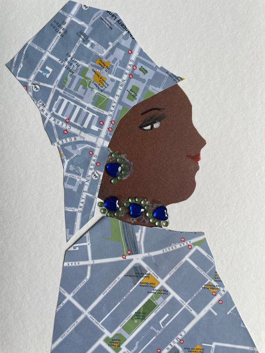 This card depicts a woman who wears a matching blouse and hat that have a map print design. She also wears blue and green earrings and necklace to match with the map print colours.