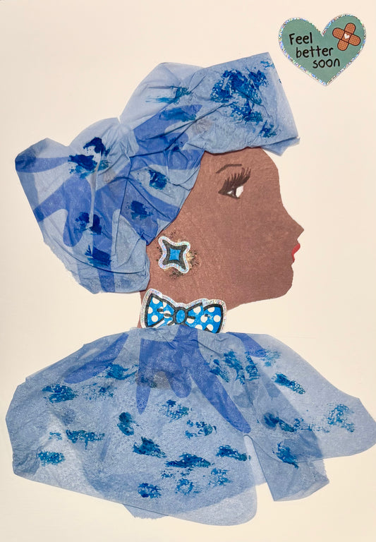 A woman wears a matching blue headwrap and blouse with darker blue splotches. She has a blue earring and bowtie with white polkadots. A sticker in the top right corner says Feel Better Soon in a teal heart. 