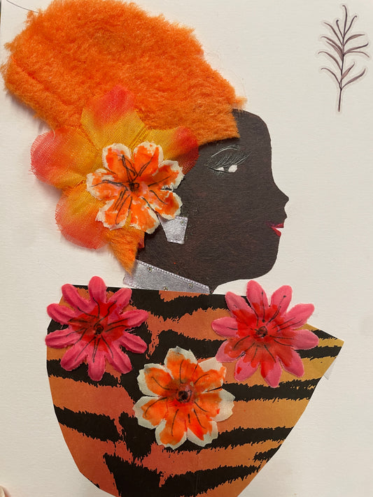 Handmade card of a woman in profile with bright orange textured hair and layered orange-yellow flowers. She wears bold silver earrings and a silver neckline. Her patterned dress features black and orange tiger stripes decorated with pink and orange fabric flowers. A small hand-drawn leaf appears in the top right corner.