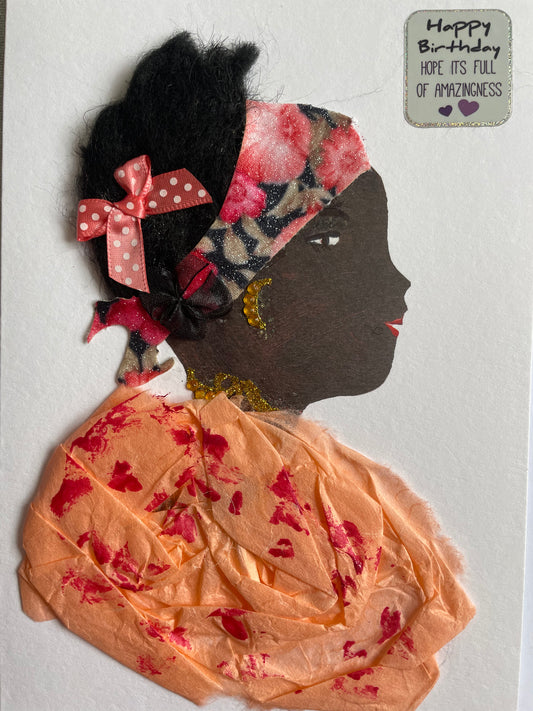 This card depicts a woman who is wearing a peach blouse that has red markings. She is also wearing a bandana and a bow ther are both pink. She also has a yellow necklace and earrings.