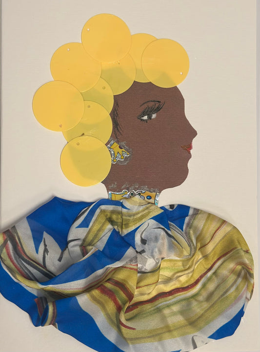 A handmade card displays a side-profile portrait of a woman with deep brown skin, long eyelashes, and pink lips. She has large yellow circular discs arranged around her head like stylized flowers, wears patterned yellow-and-silver earrings, and is draped in a blue, gold, and white patterned scarf. The overall design is bright, cheerful, and spring-inspired.