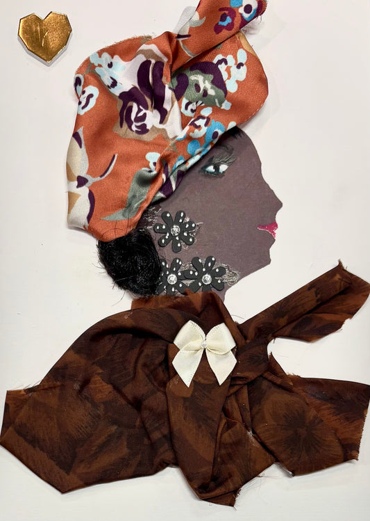 A woman wears an orange headwrap with a floral pattern. Her blouse is a chocolate brown feautirng a white bow in the center. Her earring and neckalce are made of black flowers. There is a gold heart in the top left corner of the card. 