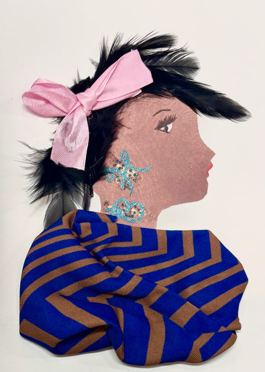 A woman has dark black hair made of feathers. She wears a pale pink bow to accessorise. Her blouse is made up of a stripe pattern with chocolate brown and royal blue. Her jewellery is made up of teal swirls. 