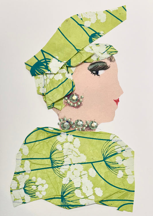 A woman wears a lime green headwrap and matching blouse. The pattern on the headwrap and blouse features flowers with thin, dark green stems and white petals. Her jewellery is a pale green sparkles. 